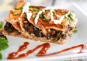 Black-Bean-Enchilladas-Topped-With-Cashew-Sour-Cream_LR-Watermark