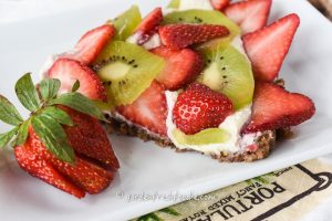 Slice of Raw Fruit Tart With Strawberries and Kiwi.