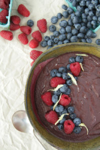 Massive antioxidant-rich smoothie bowl topped with some fresh berries is an ideal high protein vegan snack